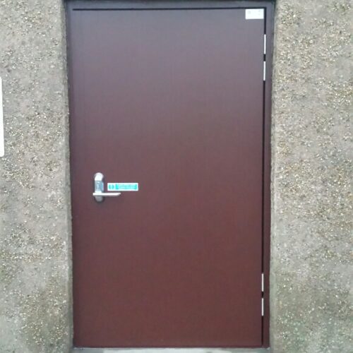Lakeside Flood Solutions - brown steel door installed