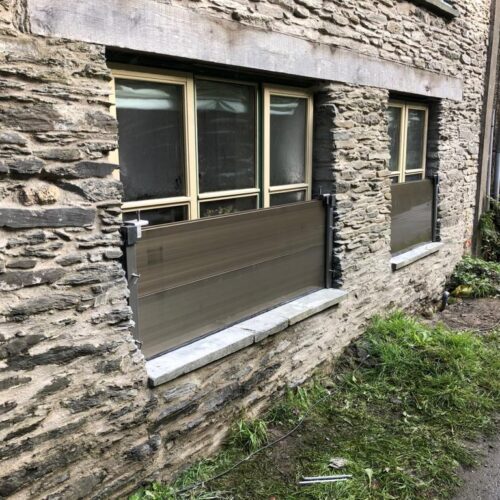 Window floor barrier for residential