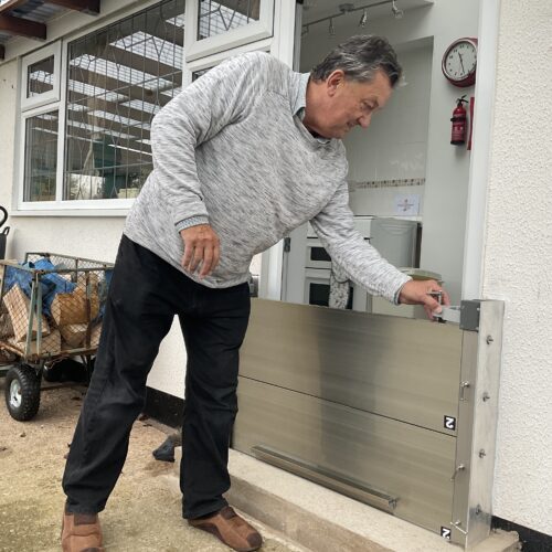 A flood barrier for a patio door installed in a home by Lakeside Flood Solutions