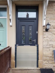 A flood barrier installed on the door of a property in Reading, Berkshire