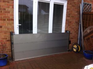 Flood defences for homes: A flood barrier installed on house patio doors by Lakeside Flood Solutions